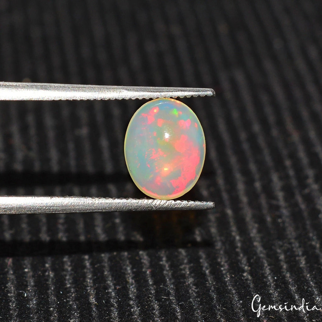 Opal Cabochon, Untreated, Multi Color — 9x7x3mm, 1.20 Ct, Ethiopia