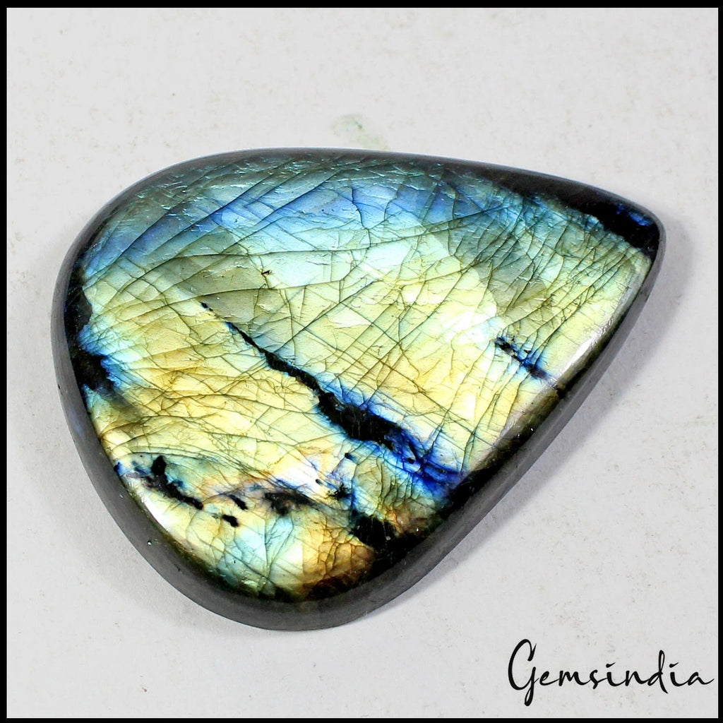 Spectrolite Cabochon, Untreated — 59x47x9 mm, 205.80 Ct