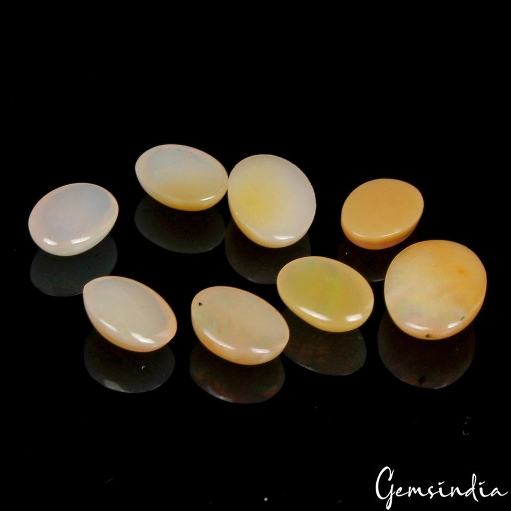 7.50 Cts Lot of Ethiopian Opal Untreated Oval Cabochons in Gem Jar 8-10mm/8 Pcs